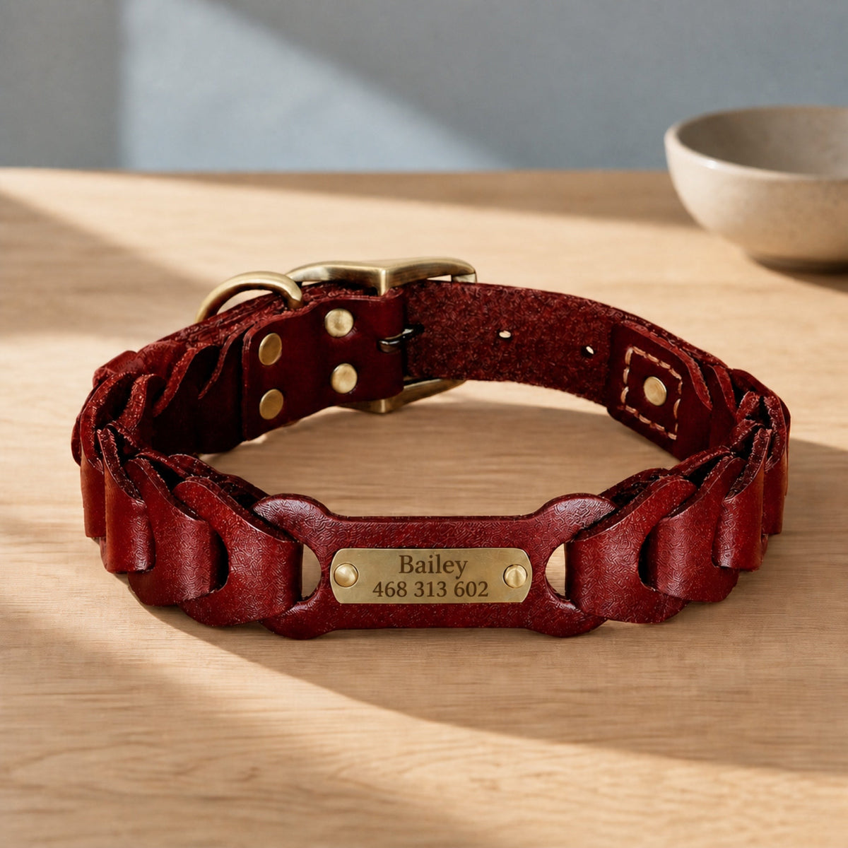 Red braided leather collar with engraved Bailey nameplate