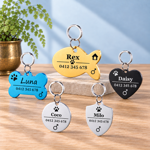 Engraved stainless-steel pet ID tags with Australian mobile number on light oak
