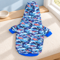 Blue camouflage dog hoodie laid flat on an ivory window seat, full back view