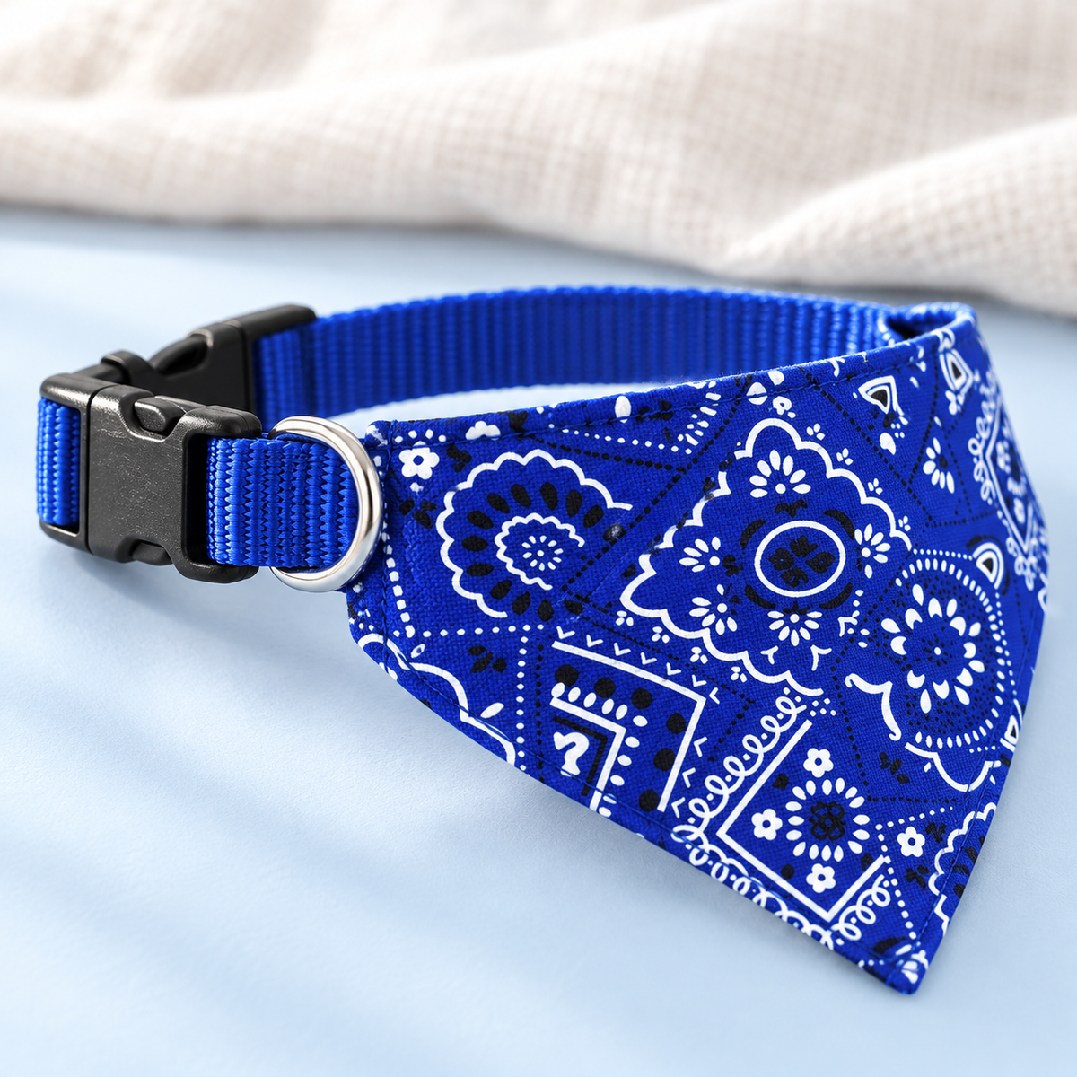 Close-up of the blue paisley bandana collar buckle, strap and D-ring