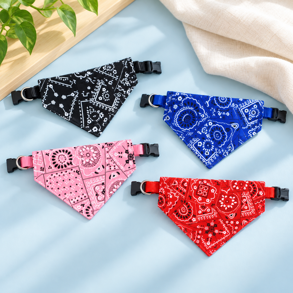 Black, blue, pink and red paisley bandana collars on a powder-blue surface